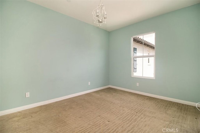 760 S Olive St, Anaheim, CA 92805 - carpeted empty room featuring a chandelier and baseboards