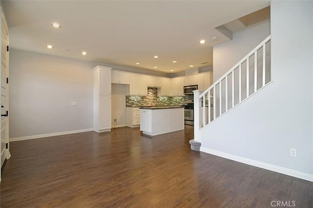 760 S Olive St, Anaheim, CA 92805 - unfurnished living room featuring stairway, recessed lighting, and dark wood-style floors
