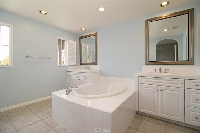 760 S Olive St, Anaheim, CA 92805 - bathroom featuring a bath, two vanities, and recessed lighting