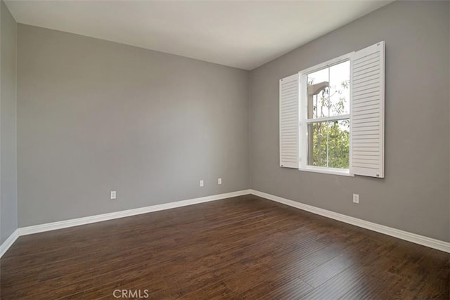760 S Olive St, Anaheim, CA 92805 - spare room featuring baseboards and dark wood-style floors