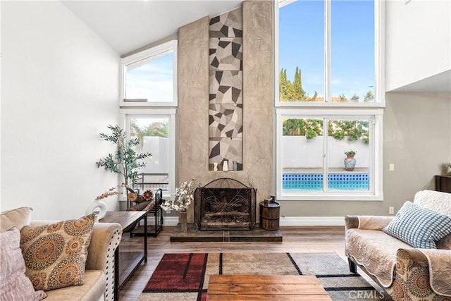 2040 Cape Cod Ct, Claremont, CA 91711 - living room with high vaulted ceiling, wood finished floors, and a premium fireplace