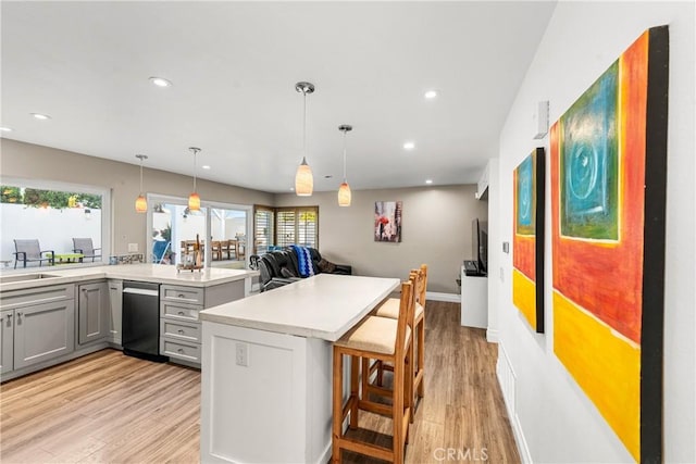 2040 Cape Cod Ct, Claremont, CA 91711 - kitchen with gray cabinetry, light wood-type flooring, a kitchen breakfast bar, light countertops, and recessed lighting