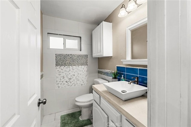 2040 Cape Cod Ct, Claremont, CA 91711 - half bath with tile walls, vanity, and tile patterned floors