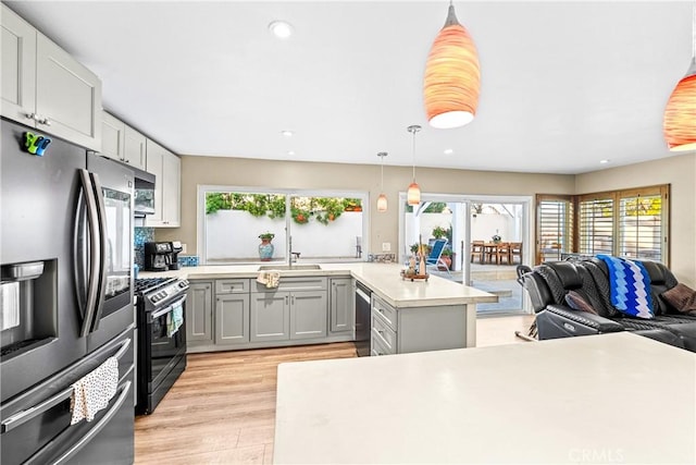 2040 Cape Cod Ct, Claremont, CA 91711 - kitchen with stainless steel appliances, open floor plan, healthy amount of natural light, light countertops, and recessed lighting