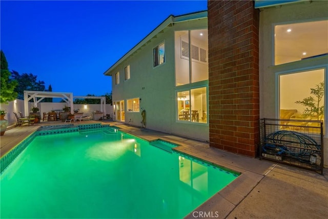 2040 Cape Cod Ct, Claremont, CA 91711 - pool at night with a patio and a fenced backyard