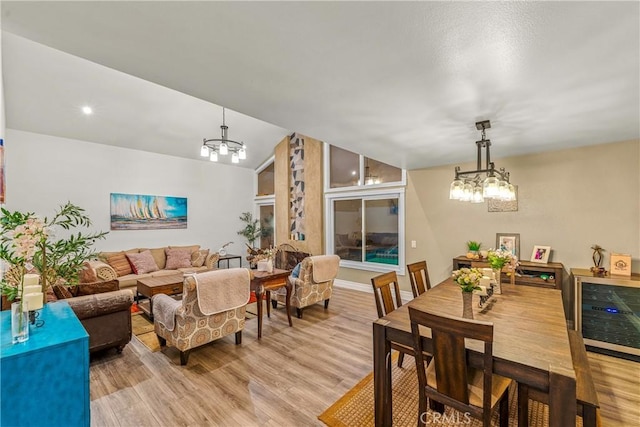 2040 Cape Cod Ct, Claremont, CA 91711 - dining space featuring a chandelier, light wood-style flooring, wine cooler, and lofted ceiling