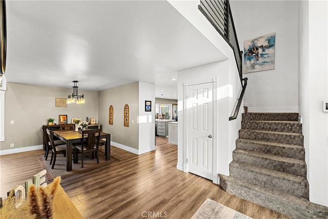 2040 Cape Cod Ct, Claremont, CA 91711 - dining room with stairway, a chandelier, wood finished floors, and recessed lighting