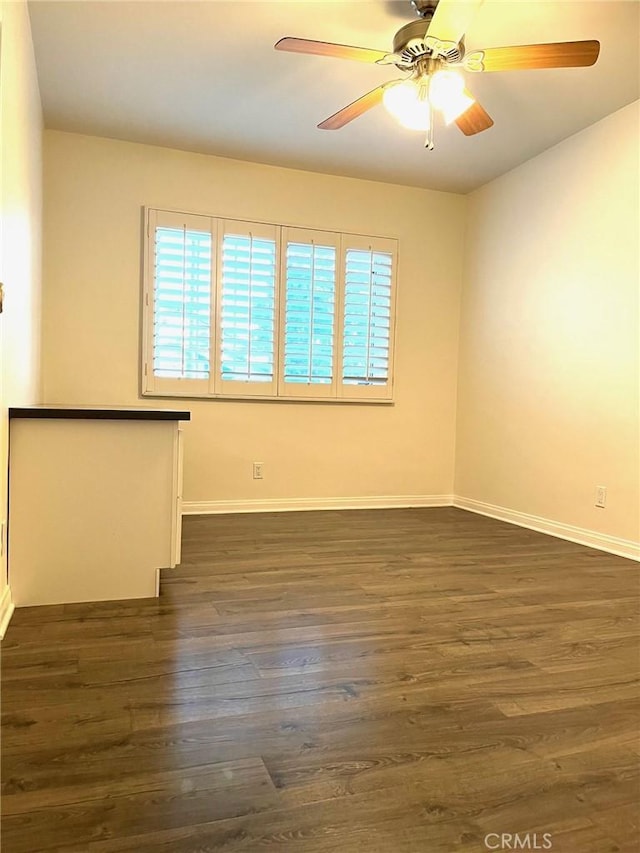 8049 Le Berthon St, Sunland, CA 91040 - empty room with plenty of natural light, ceiling fan, and dark wood-type flooring