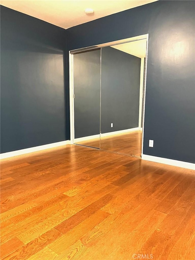 8049 Le Berthon St, Sunland, CA 91040 - unfurnished bedroom with wood finished floors and a closet