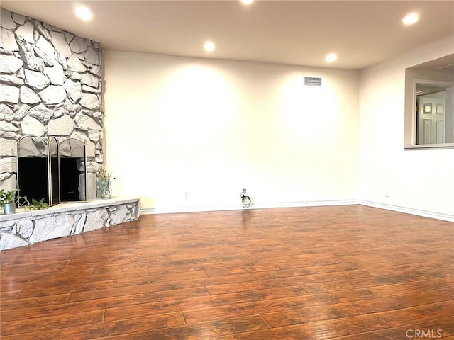8049 Le Berthon St, Sunland, CA 91040 - unfurnished living room featuring recessed lighting, hardwood / wood-style floors, and a stone fireplace