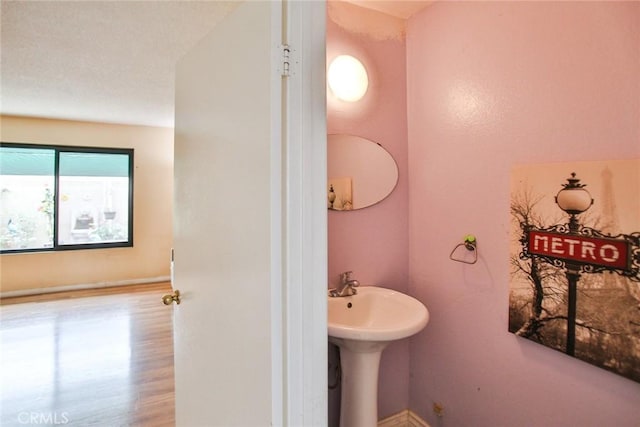 8458 Evergreen, Garden Grove, CA 92841 - bathroom featuring a sink and baseboards