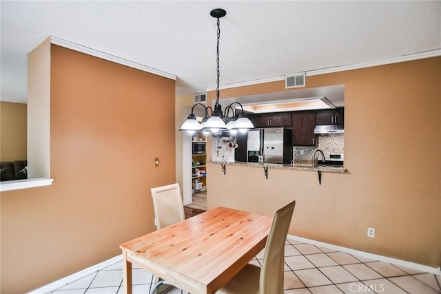 8458 Evergreen, Garden Grove, CA 92841 - dining space with baseboards and light tile patterned floors
