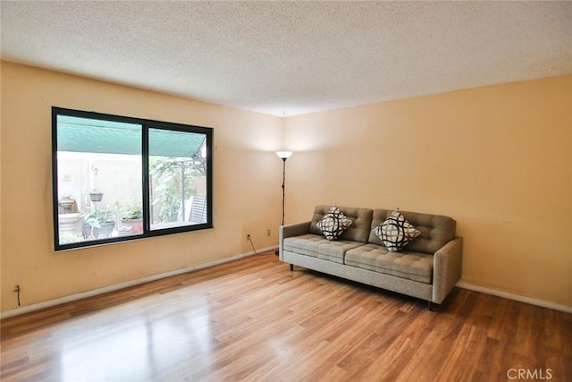 8458 Evergreen, Garden Grove, CA 92841 - living room featuring wood finished floors and a textured ceiling