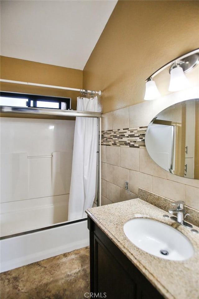 8458 Evergreen, Garden Grove, CA 92841 - bathroom with tile walls, vanity, shower / tub combo with curtain, tasteful backsplash, and vaulted ceiling