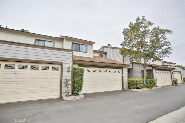 8458 Evergreen, Garden Grove, CA 92841 - multi unit property featuring a garage, stucco siding, and roof with shingles