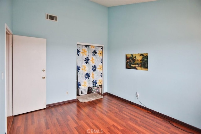 8458 Evergreen, Garden Grove, CA 92841 - empty room featuring wood finished floors and a high ceiling