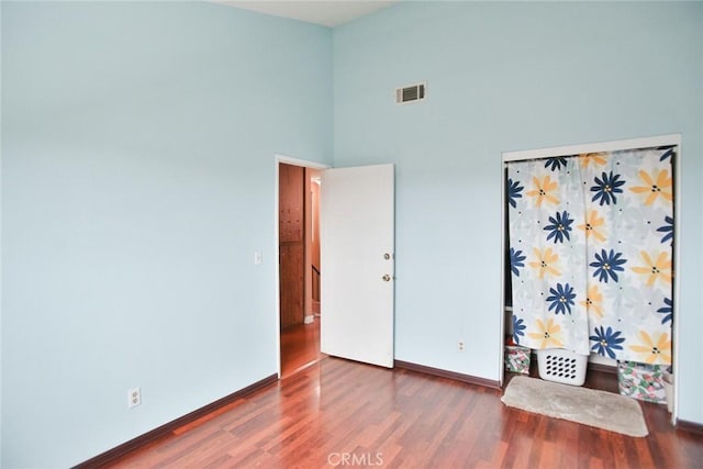 8458 Evergreen, Garden Grove, CA 92841 - unfurnished bedroom featuring wood finished floors and a high ceiling