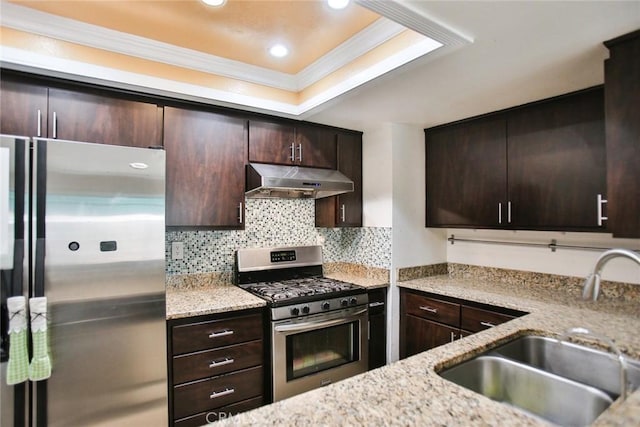 8458 Evergreen, Garden Grove, CA 92841 - kitchen with stainless steel appliances, under cabinet range hood, ornamental molding, a tray ceiling, and dark brown cabinets