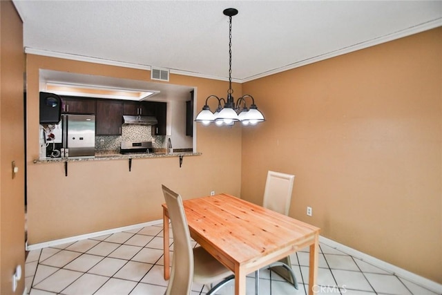 8458 Evergreen, Garden Grove, CA 92841 - dining area with crown molding, light tile patterned floors, and a chandelier