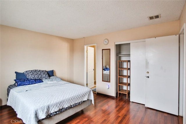 8458 Evergreen, Garden Grove, CA 92841 - bedroom featuring wood finished floors, a textured ceiling, and a closet