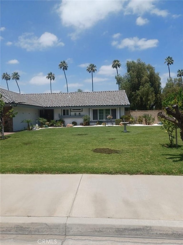 9849 Canada Way, Riverside, CA 92503 - view of front of house featuring a tile roof, a front yard, and stucco siding