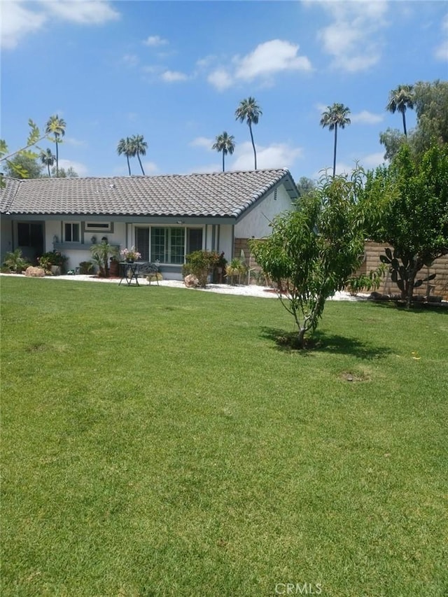 9849 Canada Way, Riverside, CA 92503 - rear view of property with a tiled roof, a yard, and stucco siding