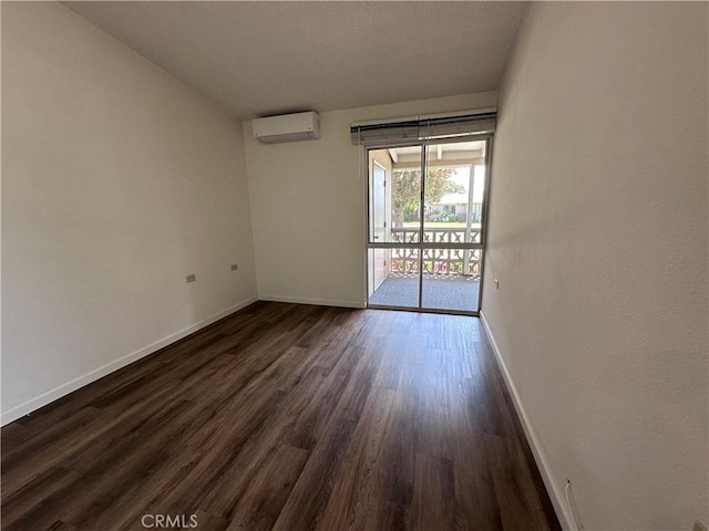 1271 Kenwood Unit 163D, Seal Beach, CA 90740 - unfurnished room with a wall unit AC and dark wood-style floors