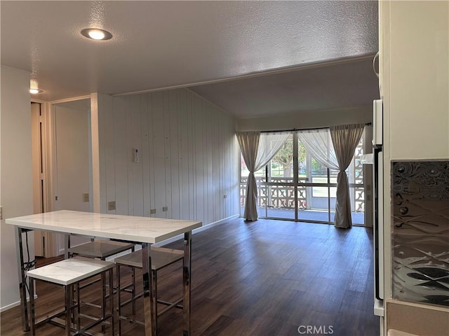 1271 Kenwood Unit 163D, Seal Beach, CA 90740 - dining area with dark wood-style flooring and baseboards