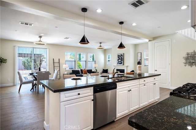 30316 Slate St, Murrieta, CA 92563 - kitchen with dishwasher, dark wood-style floors, a kitchen island with sink, open floor plan, and recessed lighting