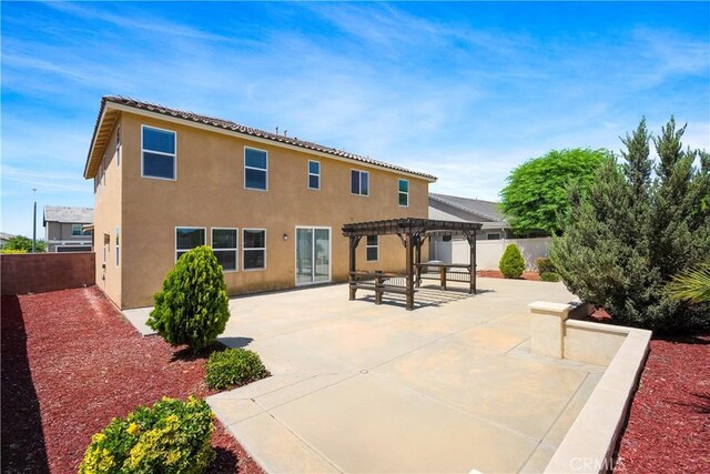 30316 Slate St, Murrieta, CA 92563 - back of house with a pergola, a fenced backyard, a patio, and stucco siding