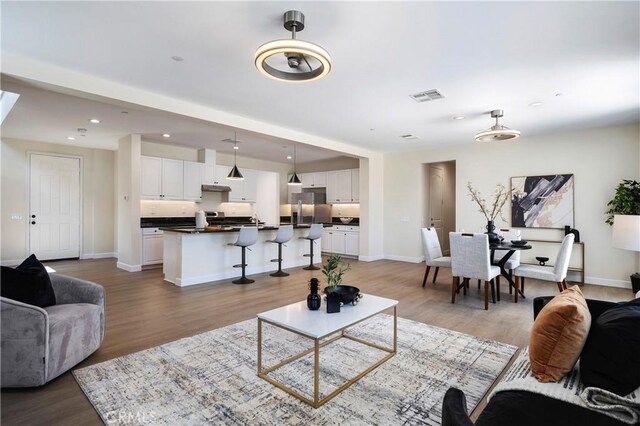 30316 Slate St, Murrieta, CA 92563 - living area with light wood-style floors and recessed lighting