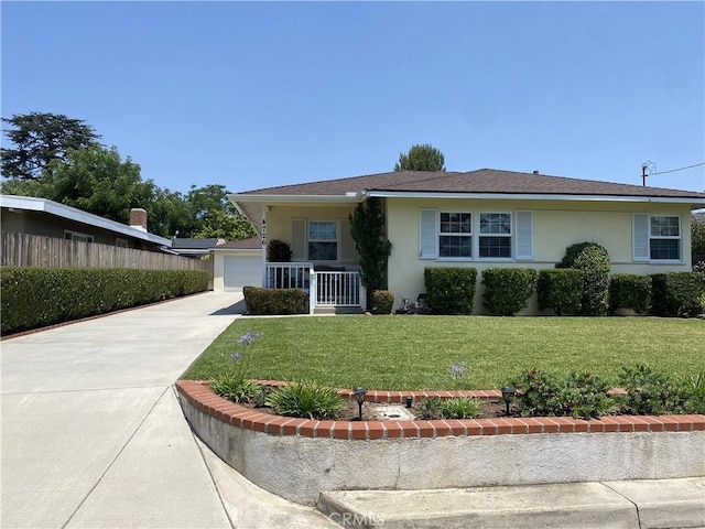 4726 N Edenfield Ave, Covina, CA 91722 - view of front of house featuring stucco siding, a front yard, a garage, and covered porch