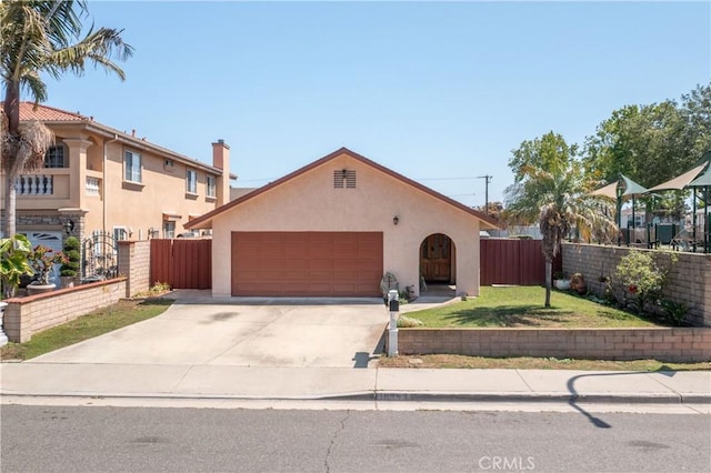 10262 Circulo De Juarez, Fountain Valley, CA 92708 - view of front of property with an attached garage, stucco siding, and concrete driveway