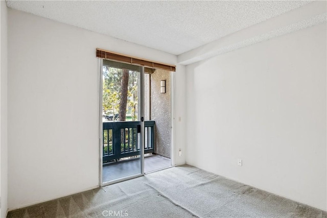 1441 Brett Pl Unit 148, San Pedro, CA 90732 - carpeted spare room with a textured ceiling