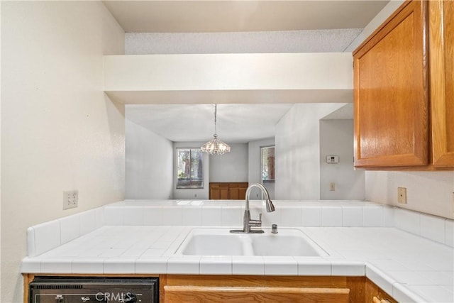 1441 Brett Pl Unit 148, San Pedro, CA 90732 - kitchen featuring brown cabinetry, a chandelier, and light countertops