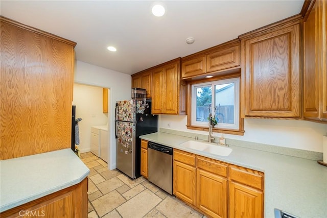 533 Via Vista Dr, Redlands, CA 92373 - kitchen featuring stainless steel appliances, washer and clothes dryer, brown cabinets, light countertops, and recessed lighting