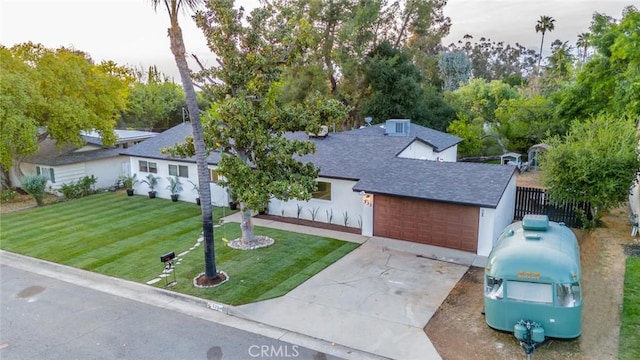 533 Via Vista Dr, Redlands, CA 92373 - view of front of house featuring roof with shingles, a garage, driveway, and stucco siding