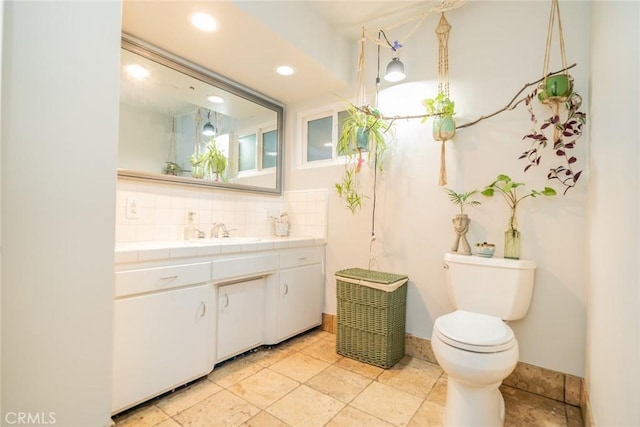 533 Via Vista Dr, Redlands, CA 92373 - bathroom featuring vanity, tasteful backsplash, and recessed lighting