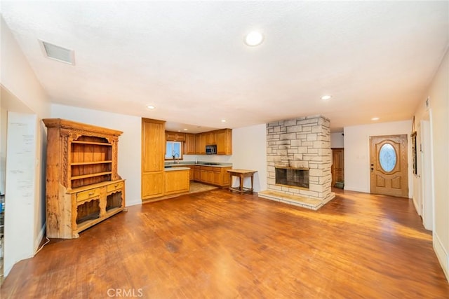 533 Via Vista Dr, Redlands, CA 92373 - unfurnished living room with dark wood-type flooring, a fireplace, and recessed lighting