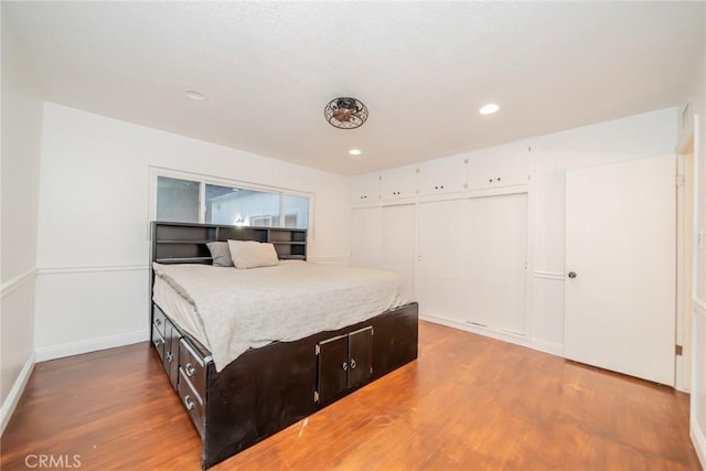 533 Via Vista Dr, Redlands, CA 92373 - bedroom featuring wood finished floors, a closet, and recessed lighting
