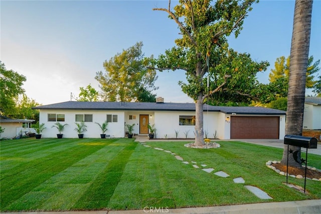 533 Via Vista Dr, Redlands, CA 92373 - ranch-style house featuring driveway, a garage, a front yard, and stucco siding