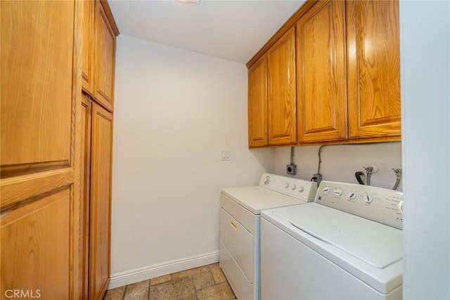 533 Via Vista Dr, Redlands, CA 92373 - laundry area featuring washing machine and clothes dryer, cabinet space, and stone tile floors