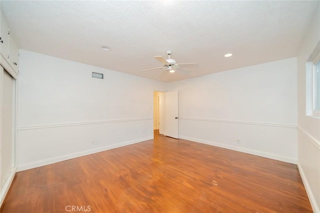 533 Via Vista Dr, Redlands, CA 92373 - empty room with wood finished floors, ceiling fan, recessed lighting, and a textured ceiling
