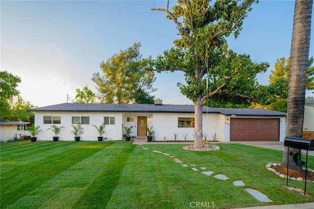 533 Via Vista Dr, Redlands, CA 92373 - single story home with concrete driveway, a garage, a front yard, and stucco siding