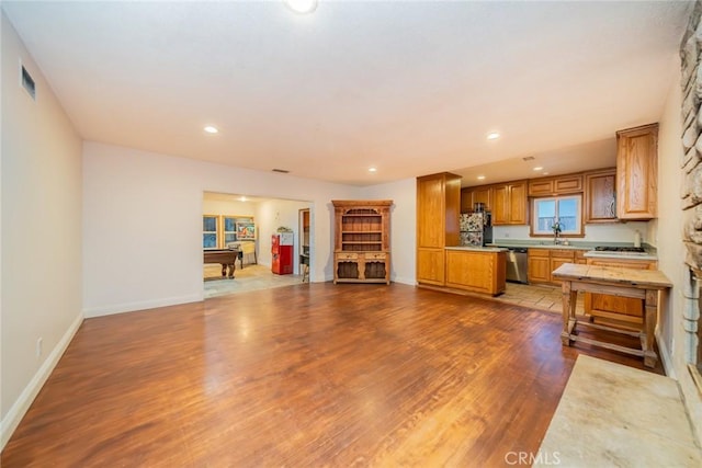 533 Via Vista Dr, Redlands, CA 92373 - kitchen with light countertops, dark wood finished floors, freestanding refrigerator, dishwasher, and recessed lighting