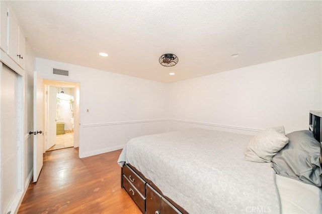 533 Via Vista Dr, Redlands, CA 92373 - bedroom featuring wood finished floors and recessed lighting