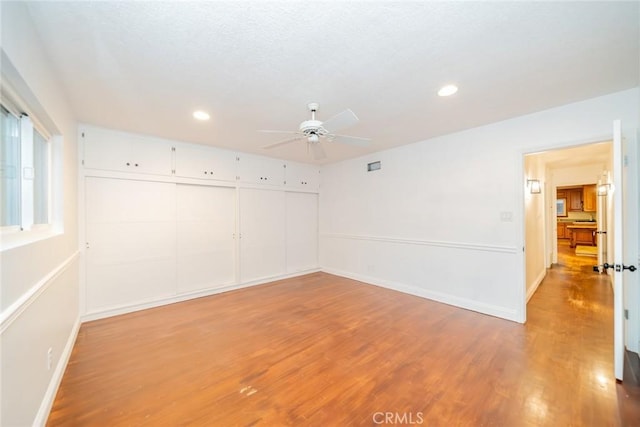 533 Via Vista Dr, Redlands, CA 92373 - empty room with a ceiling fan, wood finished floors, and recessed lighting