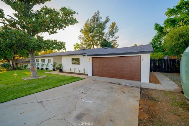 533 Via Vista Dr, Redlands, CA 92373 - ranch-style home with an attached garage, driveway, and stucco siding