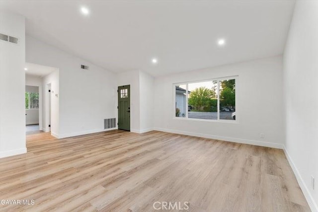 36848 Apache Plume Dr, Palmdale, CA 93550 - empty room featuring light wood-type flooring, recessed lighting, and lofted ceiling