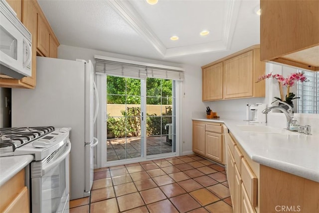 2303 Paseo Circulo, Tustin, CA 92782 - kitchen with white appliances, light brown cabinets, light countertops, a raised ceiling, and light tile patterned floors